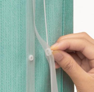 Pression permettant de séparer les deux types de rideaux du store bateau Creaty